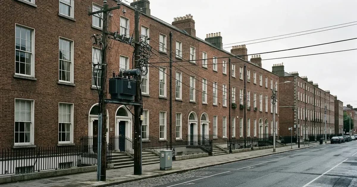 Georgian Dublin streetscape with utility power transformer and overhead electricity distribution lines. — SolarNevs spec card