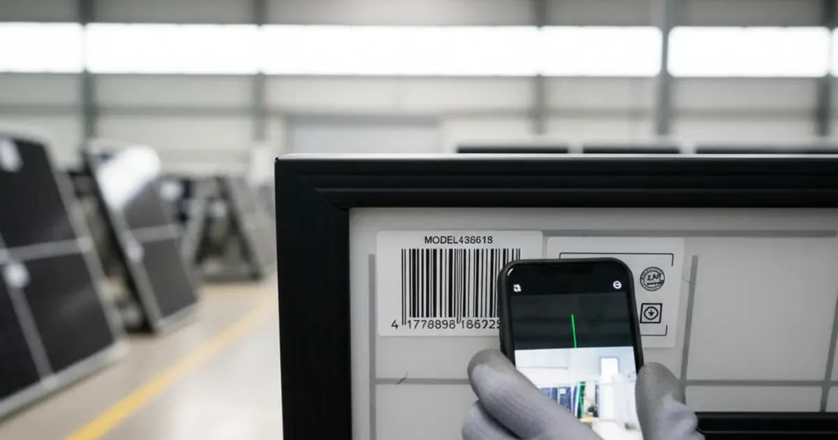 Close-up of a solar module's rear label showing serial number, model code and certification marks — SolarNevs spec card