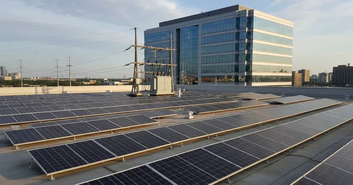 A commercial rooftop solar array with a clear view of the grid connection point and a corporate office building in the background — SolarNevs spec card