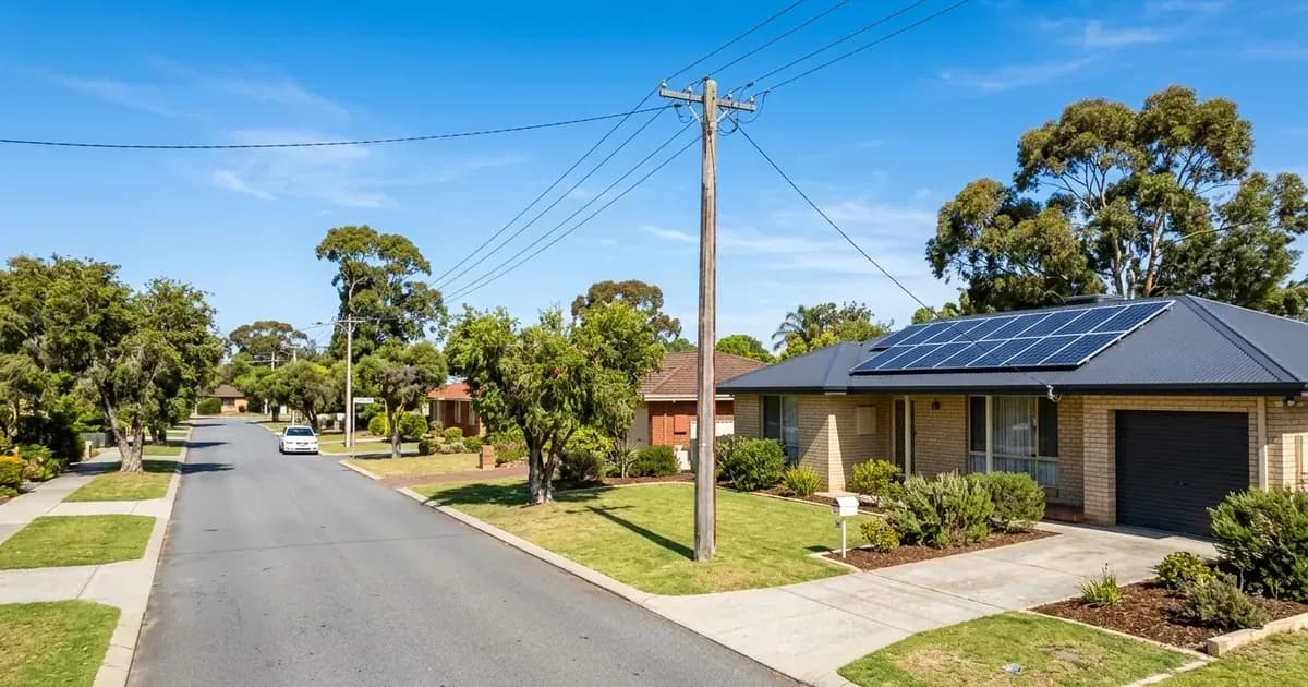 Rooftop solar panels on a suburban Australian home connected by power lines to a street utility pole. — SolarNevs spec card