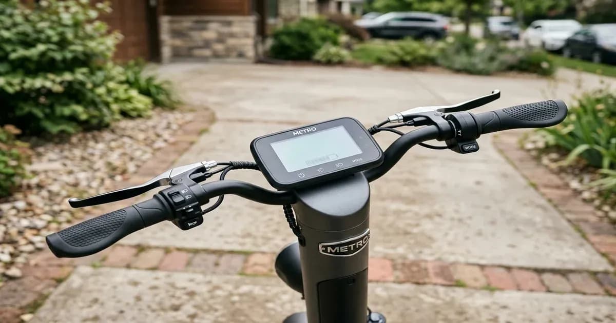 Metro electric scooter dashboard and handlebars parked in a driveway in Pakistan — SolarNevs spec card