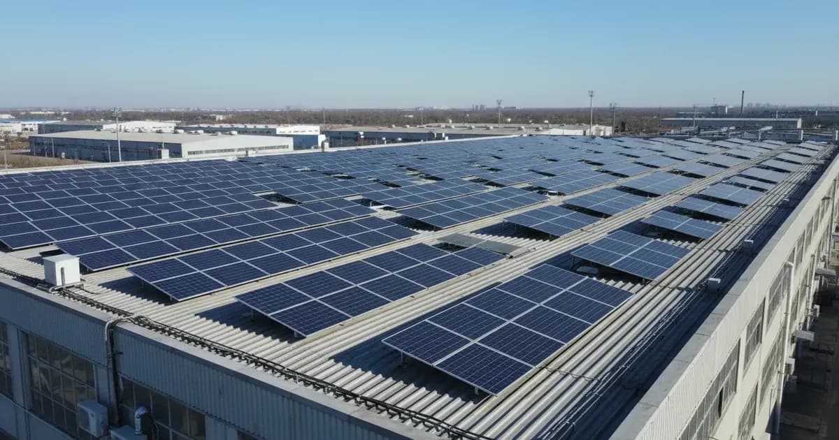 A commercial rooftop solar array on a large industrial building, with a clear blue sky — SolarNevs spec card